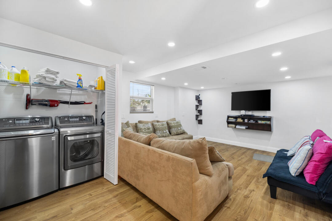 23 South Exuma Road Key Largo, FL 33037 - Photo 20 of 24 a living room with furniture and a flat screen tv
