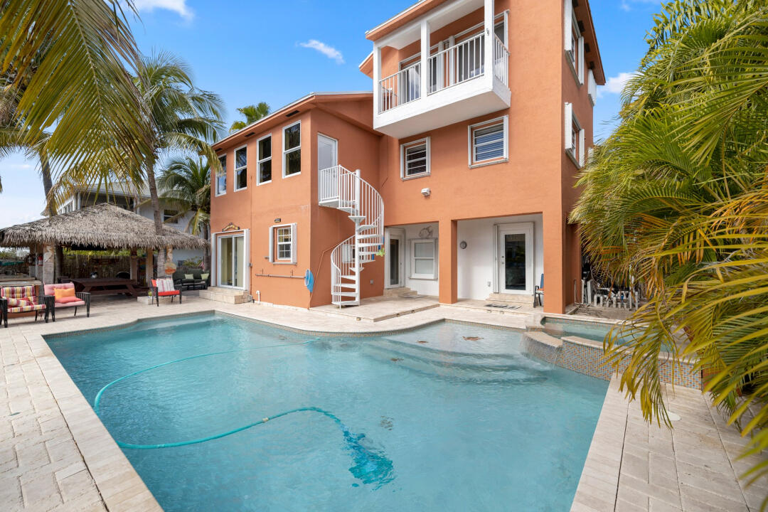 23 South Exuma Road Key Largo, FL 33037 - Photo 2 of 24 a front view of a house with a garden
