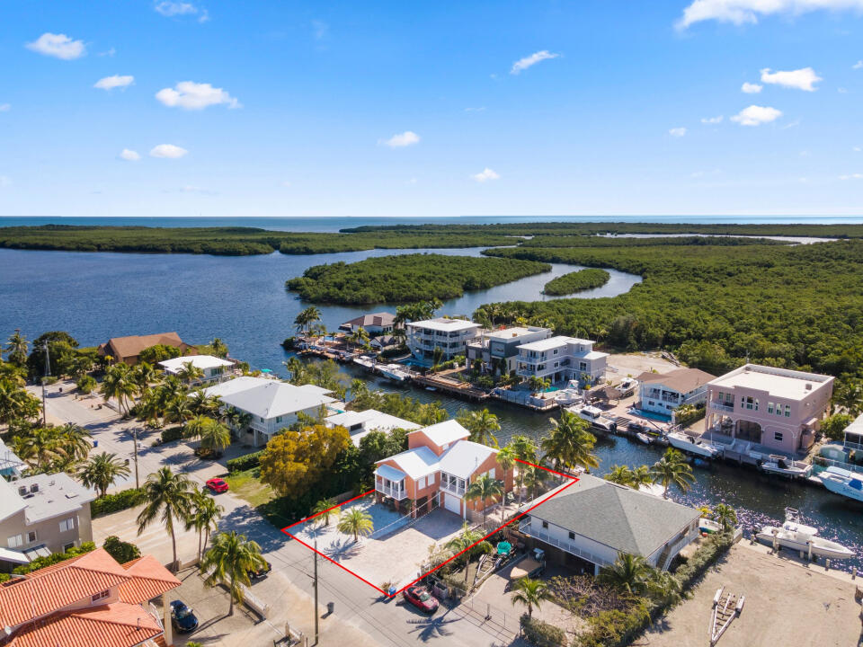 23 South Exuma Road Key Largo, FL 33037 - Photo 21 of 24 an aerial view of a house with a lake view