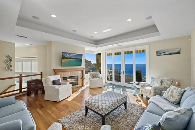 a living room with furniture potted plant and a large window