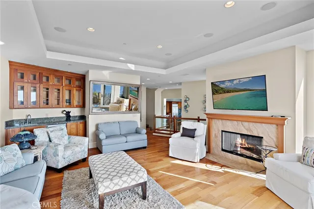 a living room with furniture a rug and a fireplace