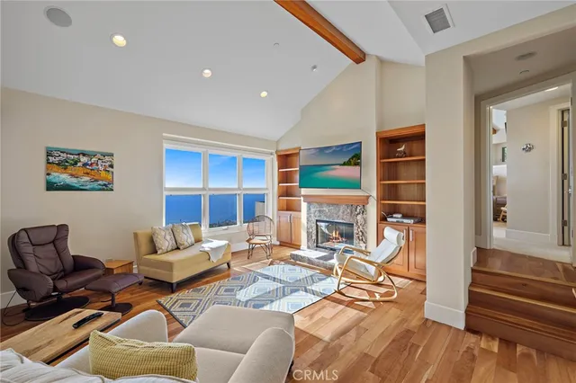 a living room with furniture fireplace and a flat screen tv