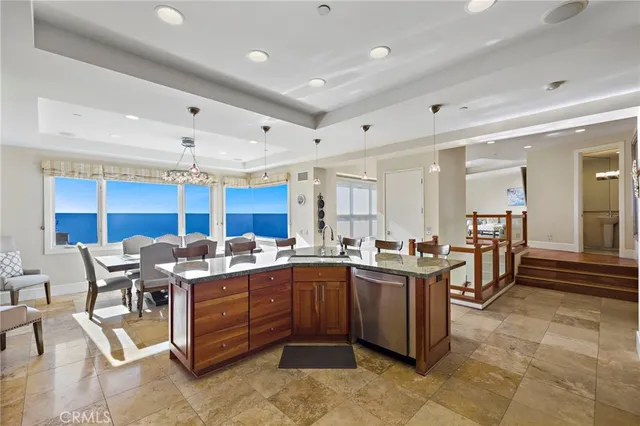 a kitchen with stainless steel appliances granite countertop a sink and cabinets
