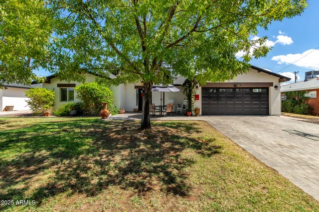a view of a backyard of the house