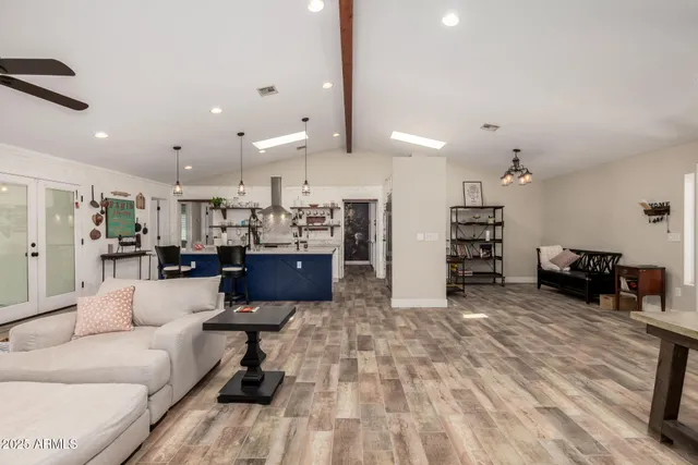 a view of a livingroom with furniture and a window