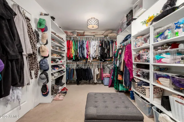 an empty room with a ceiling fan and a window
