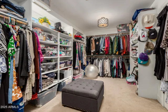a bathroom with a sink mirror and shower
