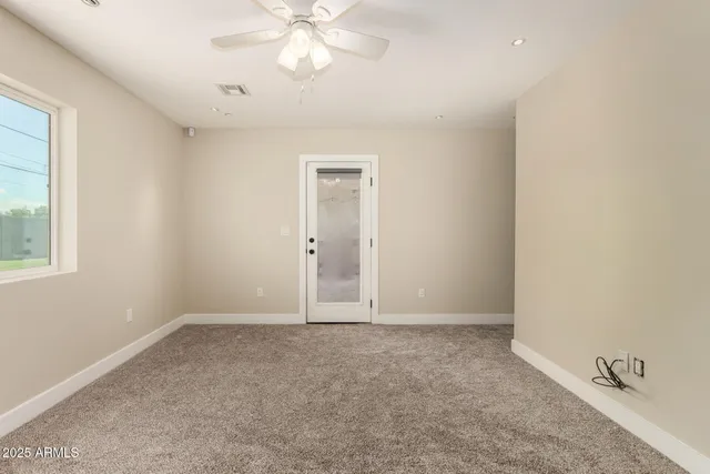 a view of a porch with a table and chairs
