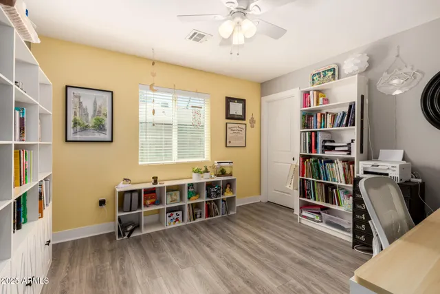 a view of a backyard with a tree