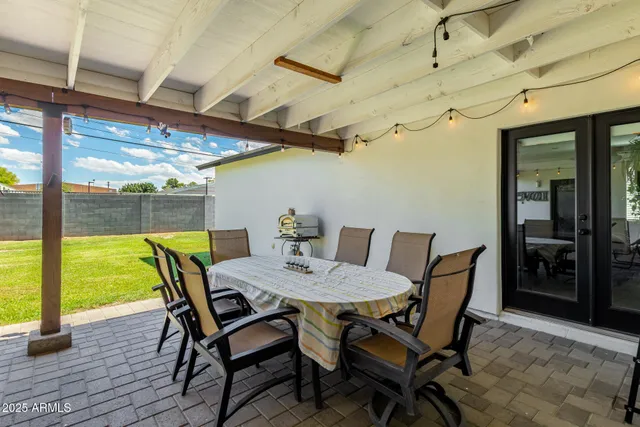 a front view of a house with a garden and yard