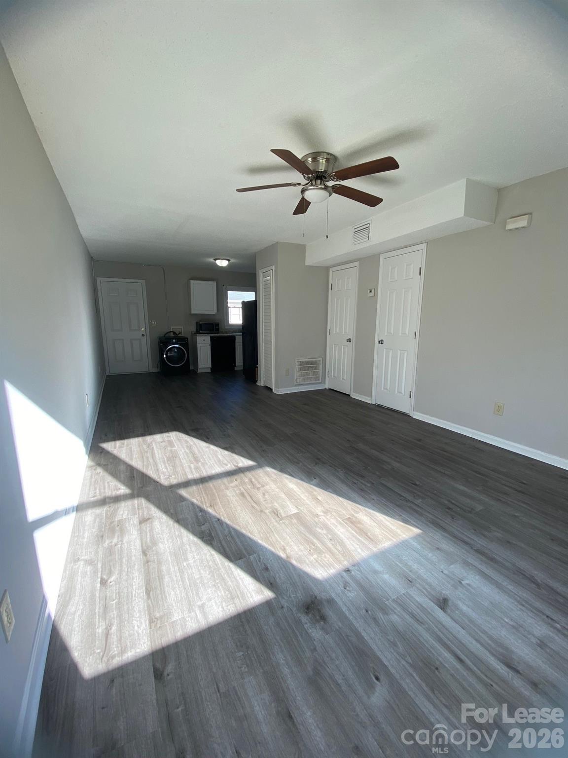900 Junius Street, Unit A Gastonia, NC 28052 - Photo 3 of 10 a view of a livingroom with wooden floor