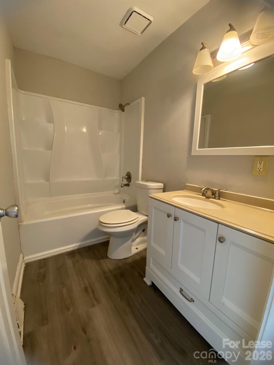 900 Junius Street, Unit A Gastonia, NC 28052 - Photo 8 of 10 a bathroom with a granite countertop sink toilet and shower