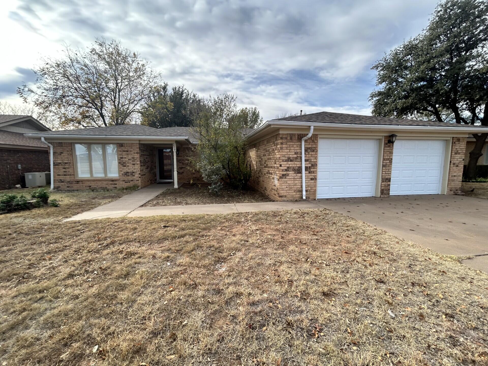 5517 89th Street Lubbock, TX 79424 - Photo 2 of 20 a view of a house with a yard