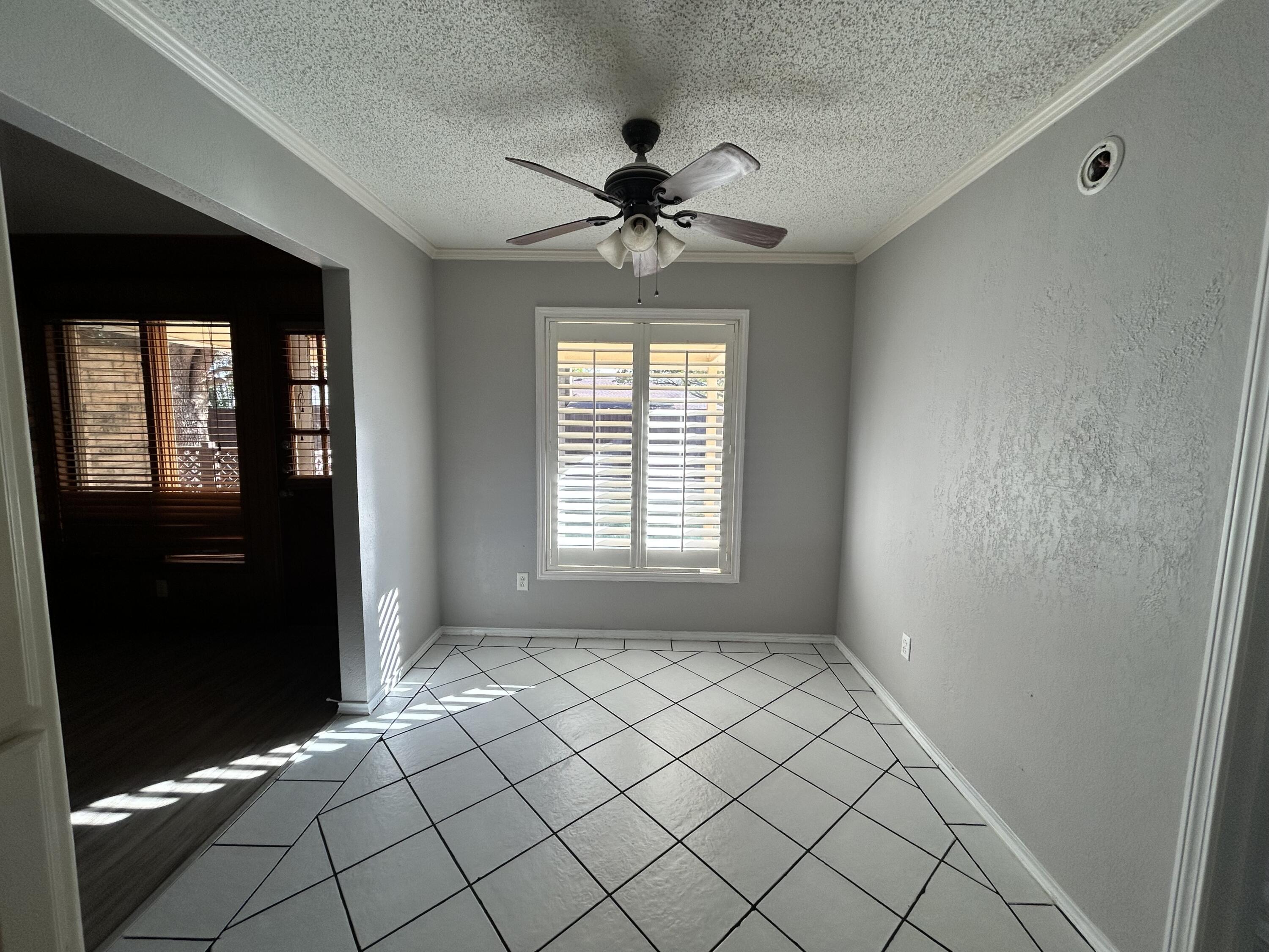 5517 89th Street Lubbock, TX 79424 - Photo 8 of 20 a view of an empty room with a window