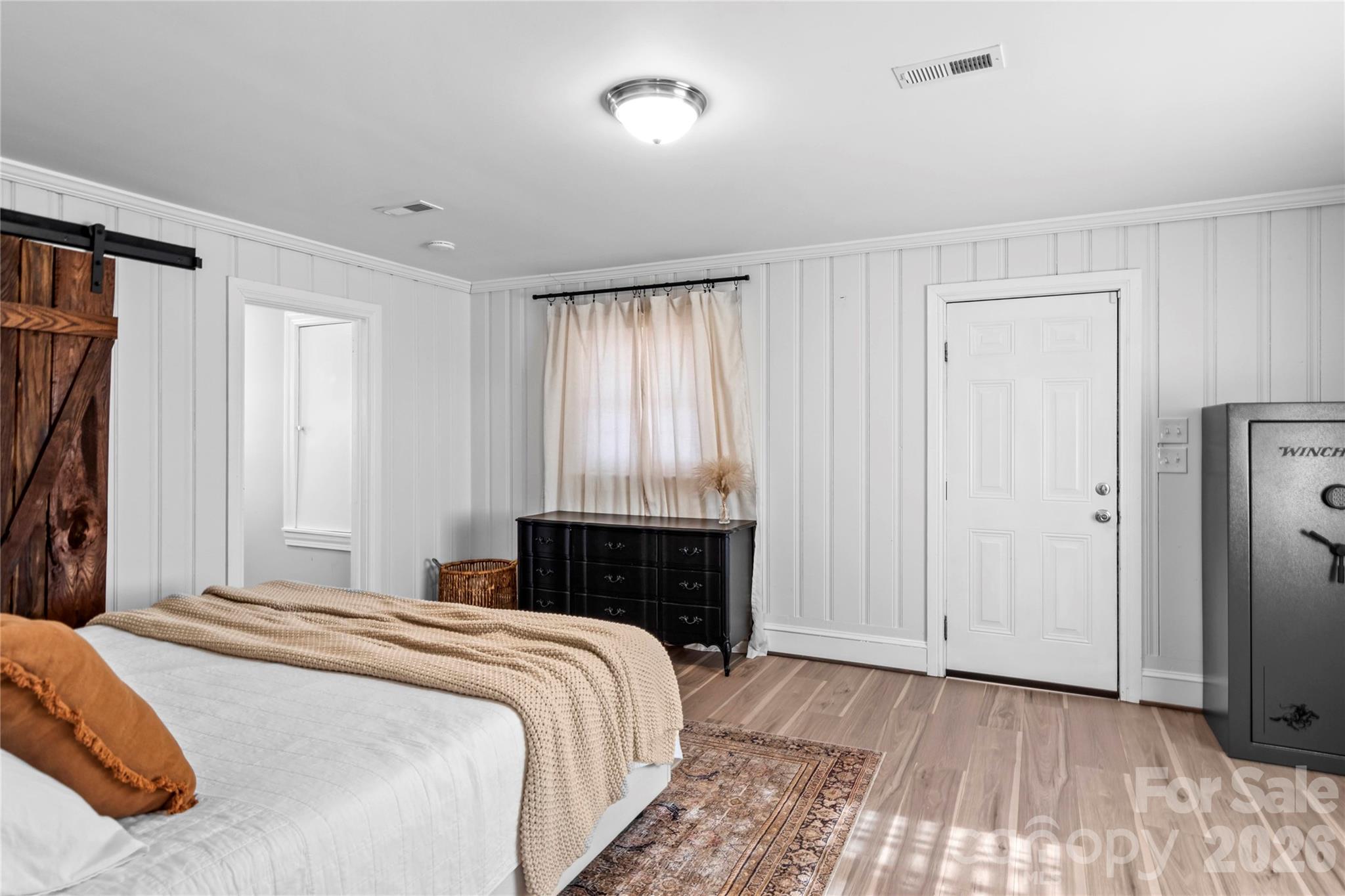 2432 Holcomb Road Yadkinville, NC 27055 - Photo 18 of 37 a bedroom with a bed and a window