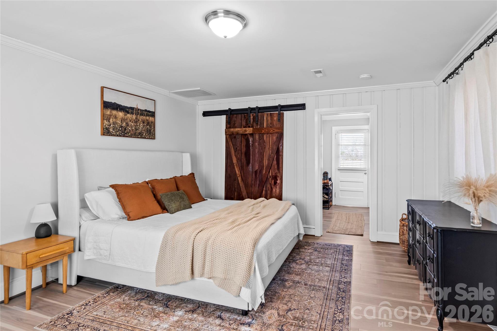 2432 Holcomb Road Yadkinville, NC 27055 - Photo 19 of 37 a bedroom with a bed and a dresser with rug