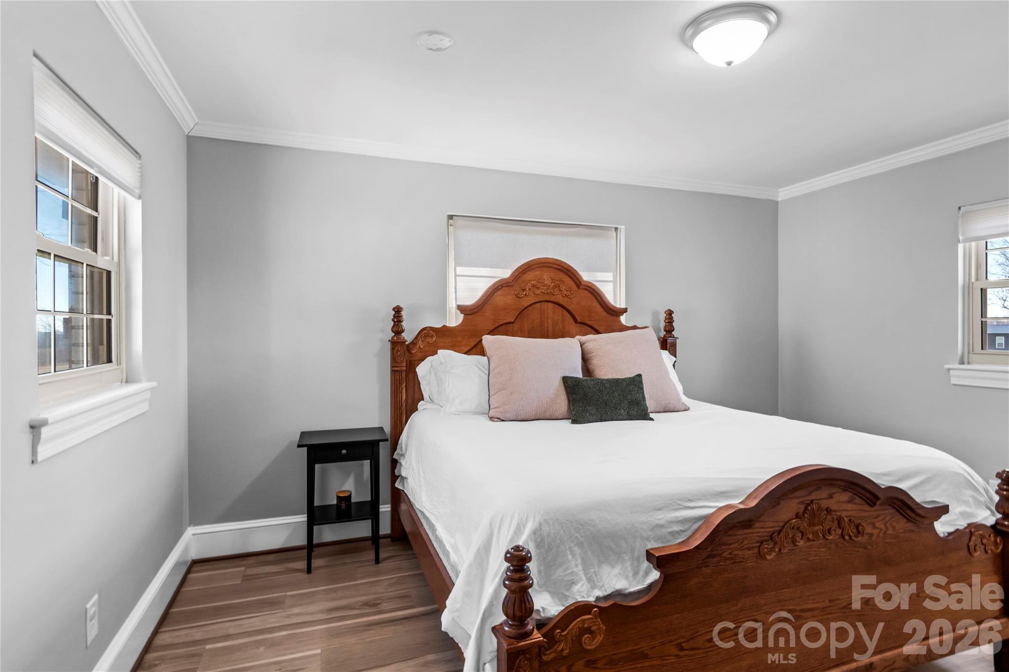 2432 Holcomb Road Yadkinville, NC 27055 - Photo 23 of 37 a bedroom with a bed and wooden floor