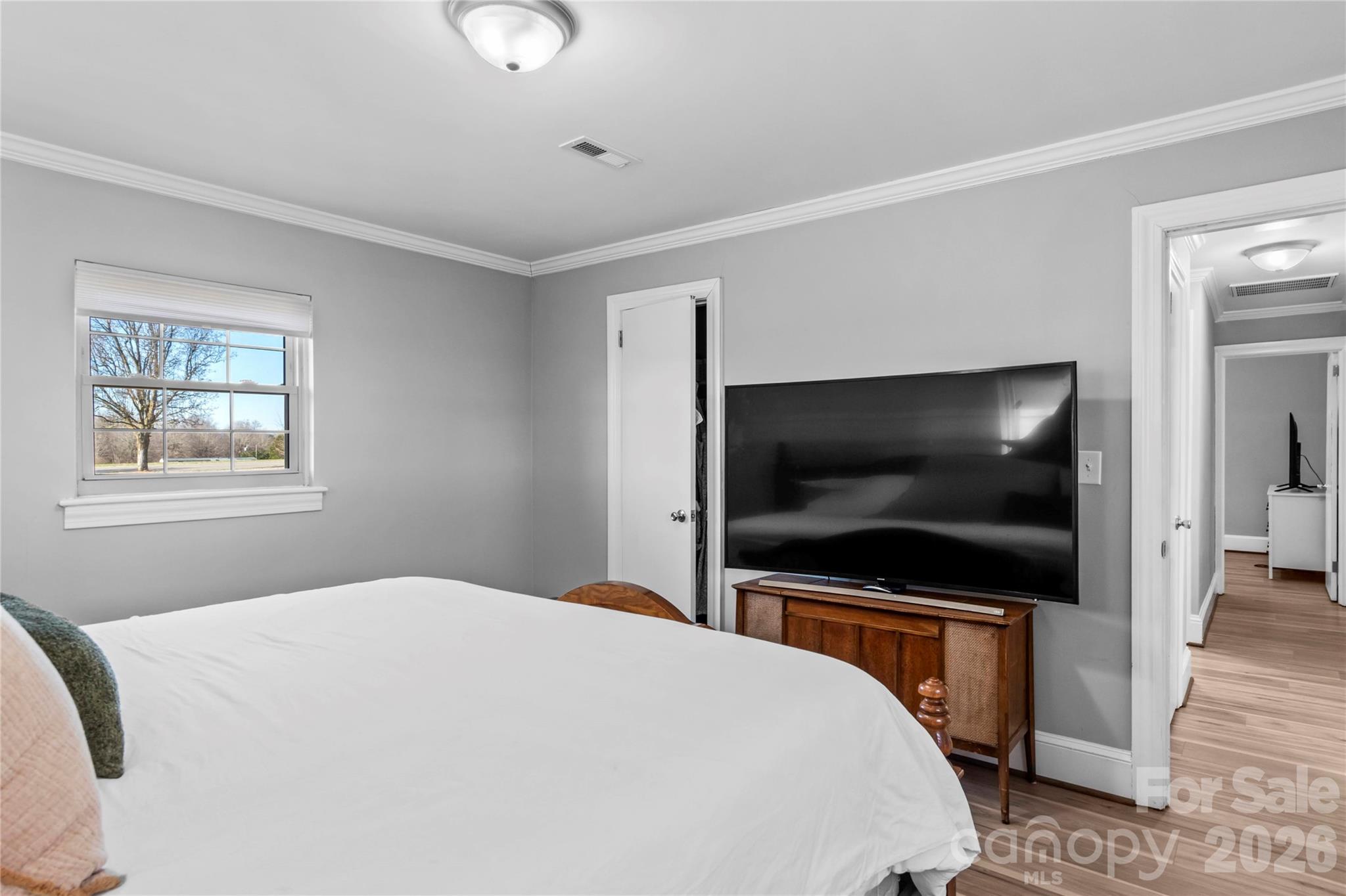 2432 Holcomb Road Yadkinville, NC 27055 - Photo 24 of 37 a bedroom with a bed and a flat screen tv