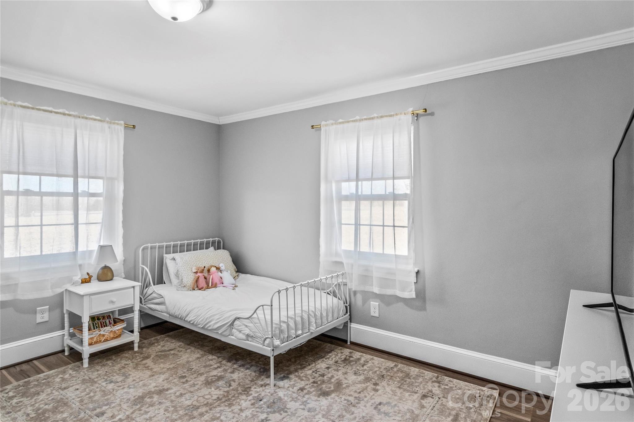 2432 Holcomb Road Yadkinville, NC 27055 - Photo 27 of 37 a bedroom with a bed and a window