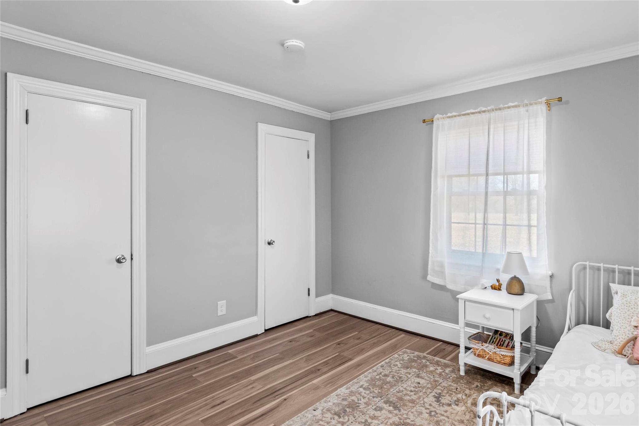 2432 Holcomb Road Yadkinville, NC 27055 - Photo 28 of 37 a bedroom with a bed and a window