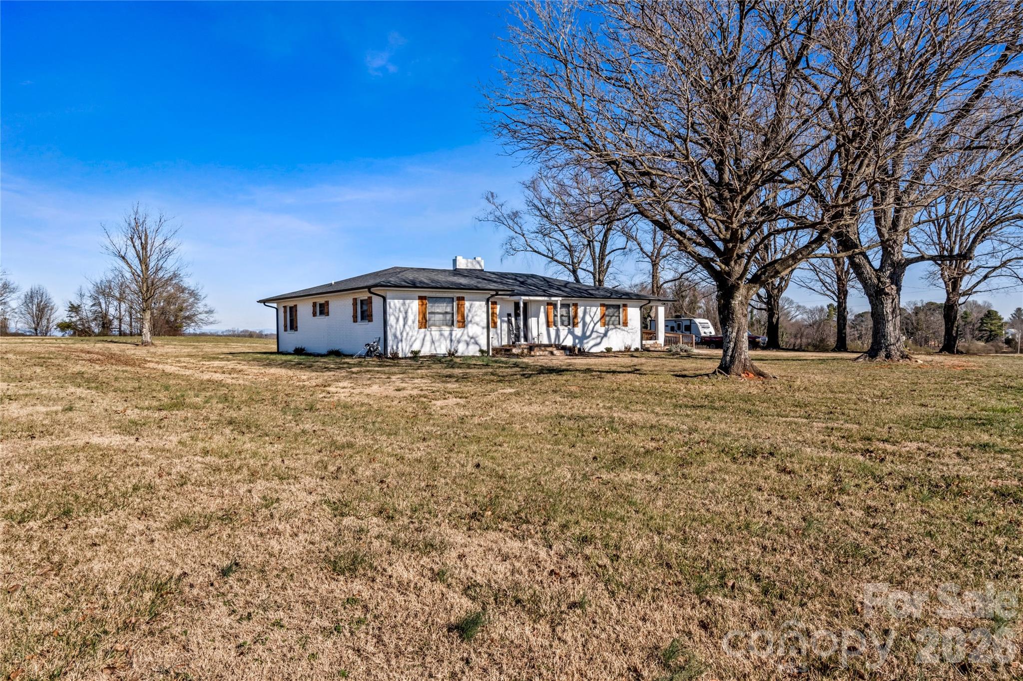 2432 Holcomb Road Yadkinville, NC 27055 - Photo 3 of 37 a front view of a house with a yard