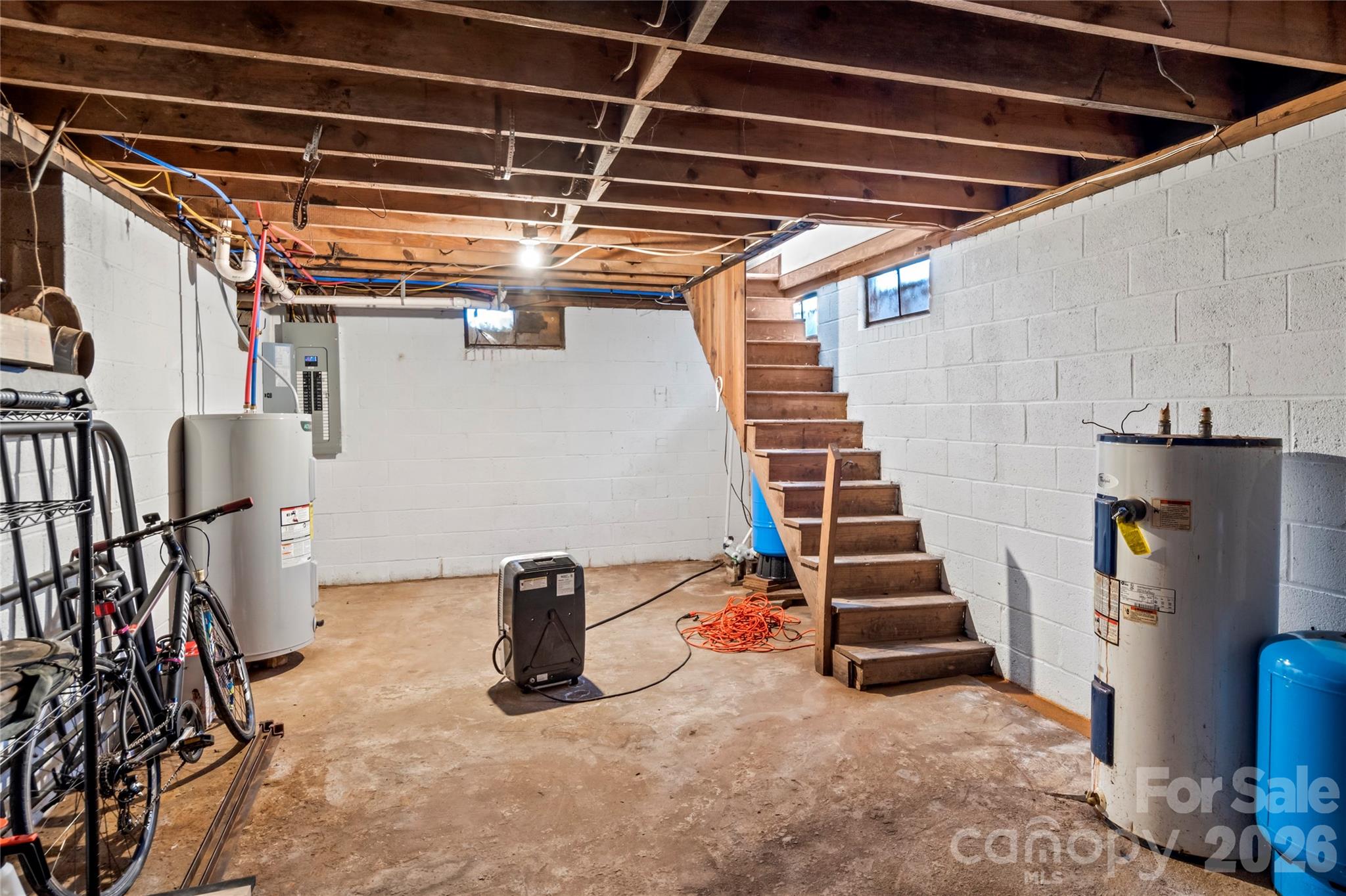 2432 Holcomb Road Yadkinville, NC 27055 - Photo 31 of 37 a view of storage and utility room with stairs