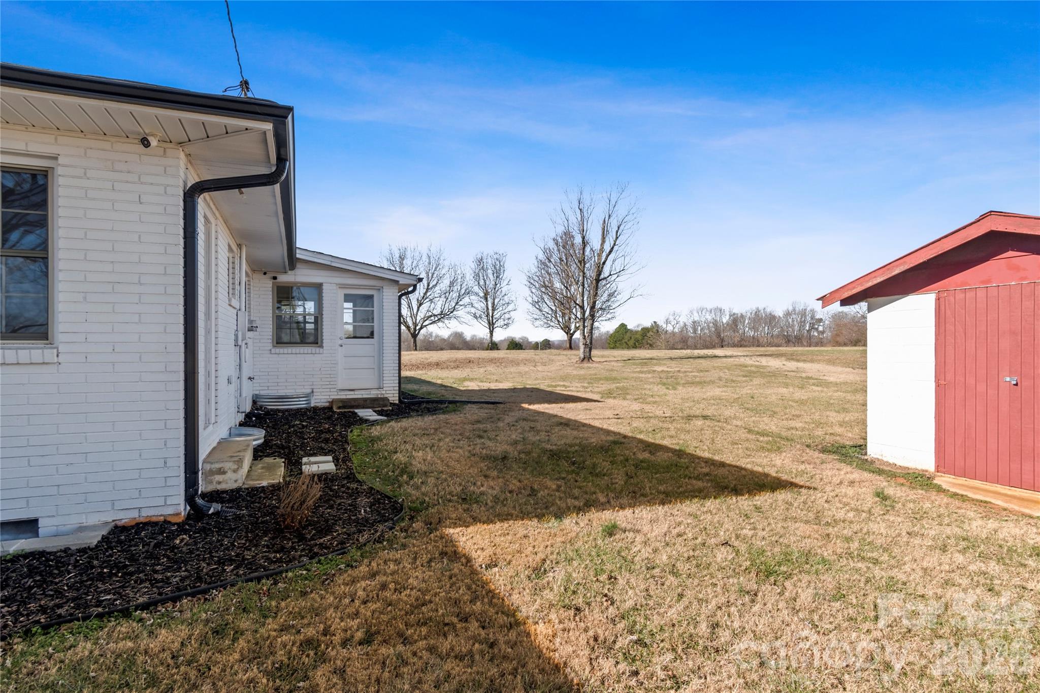 2432 Holcomb Road Yadkinville, NC 27055 - Photo 33 of 37 a view of a back yard of the house