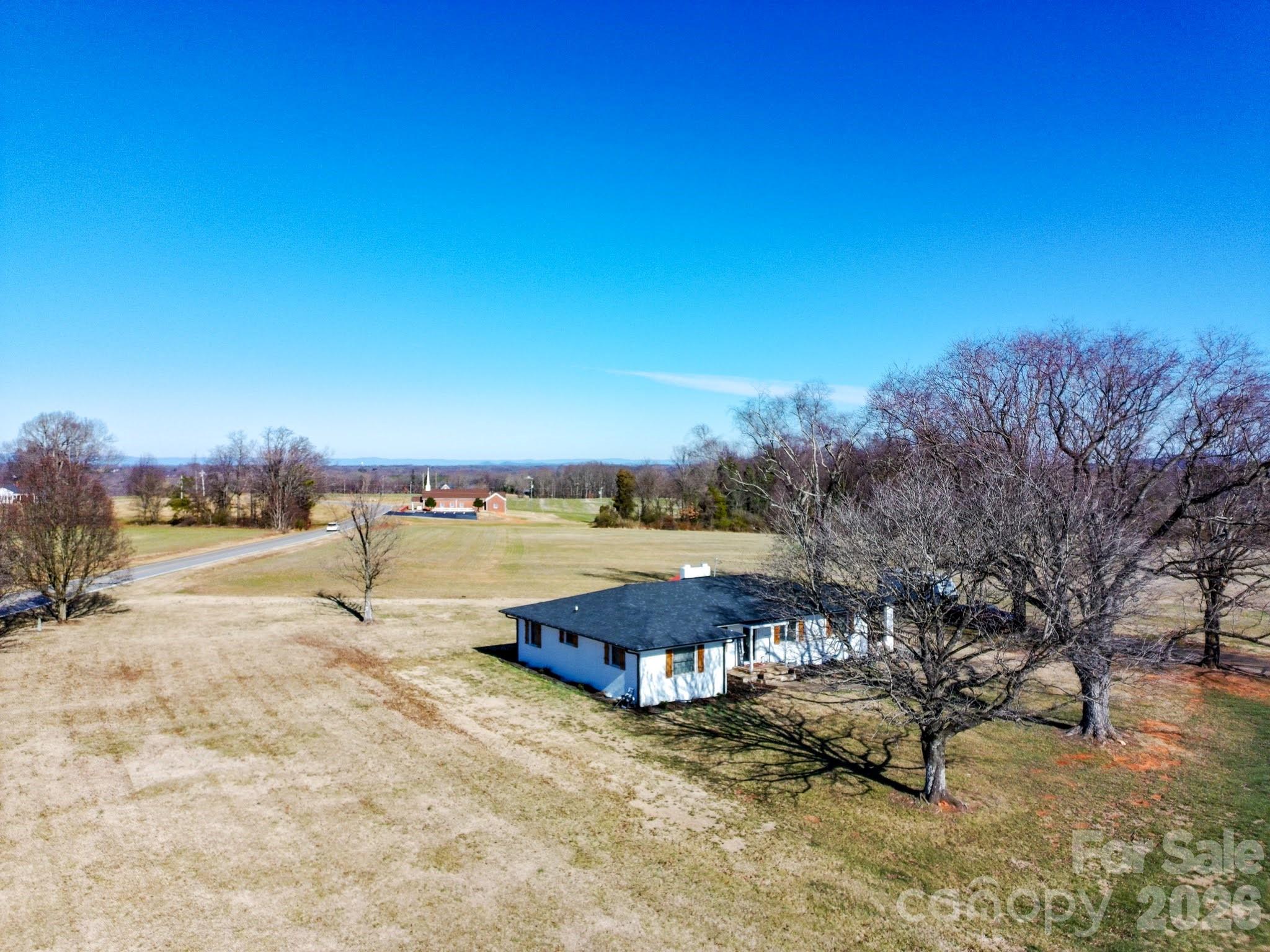 2432 Holcomb Road Yadkinville, NC 27055 - Photo 37 of 37 a view of a lake with a yard