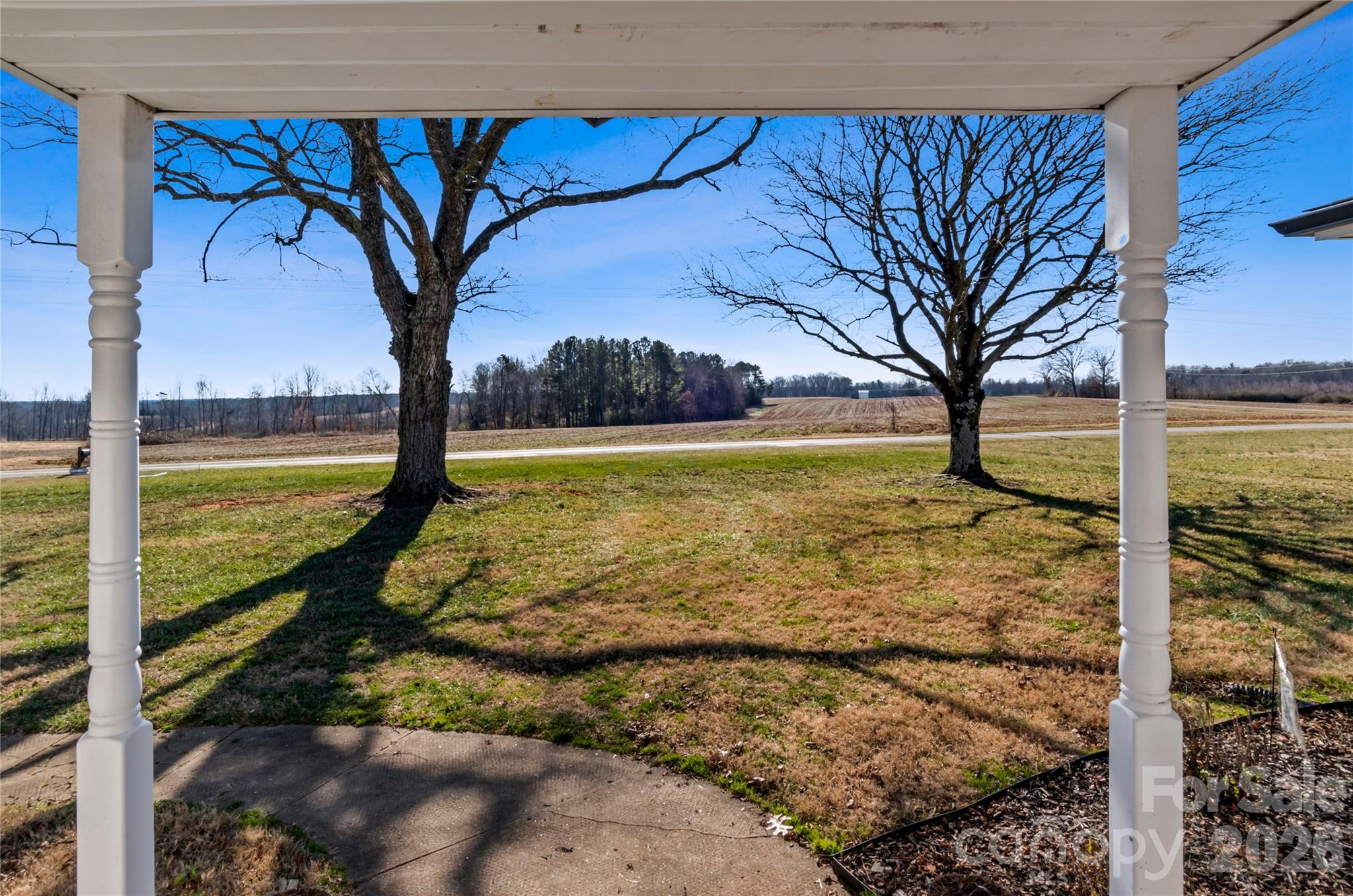 2432 Holcomb Road Yadkinville, NC 27055 - Photo 7 of 37 a view of a yard with an outdoor space