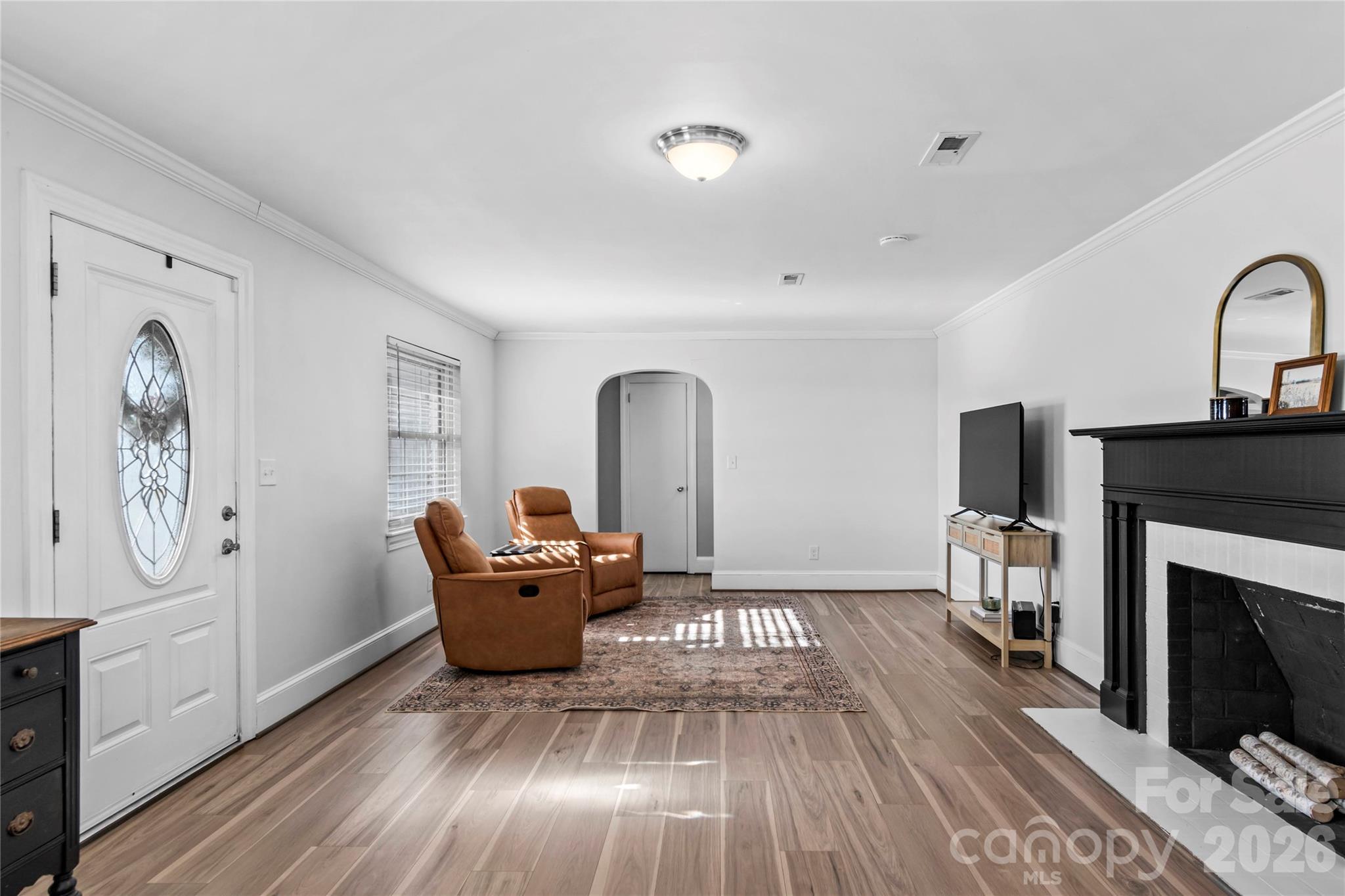 2432 Holcomb Road Yadkinville, NC 27055 - Photo 9 of 37 a living room with furniture and a fireplace