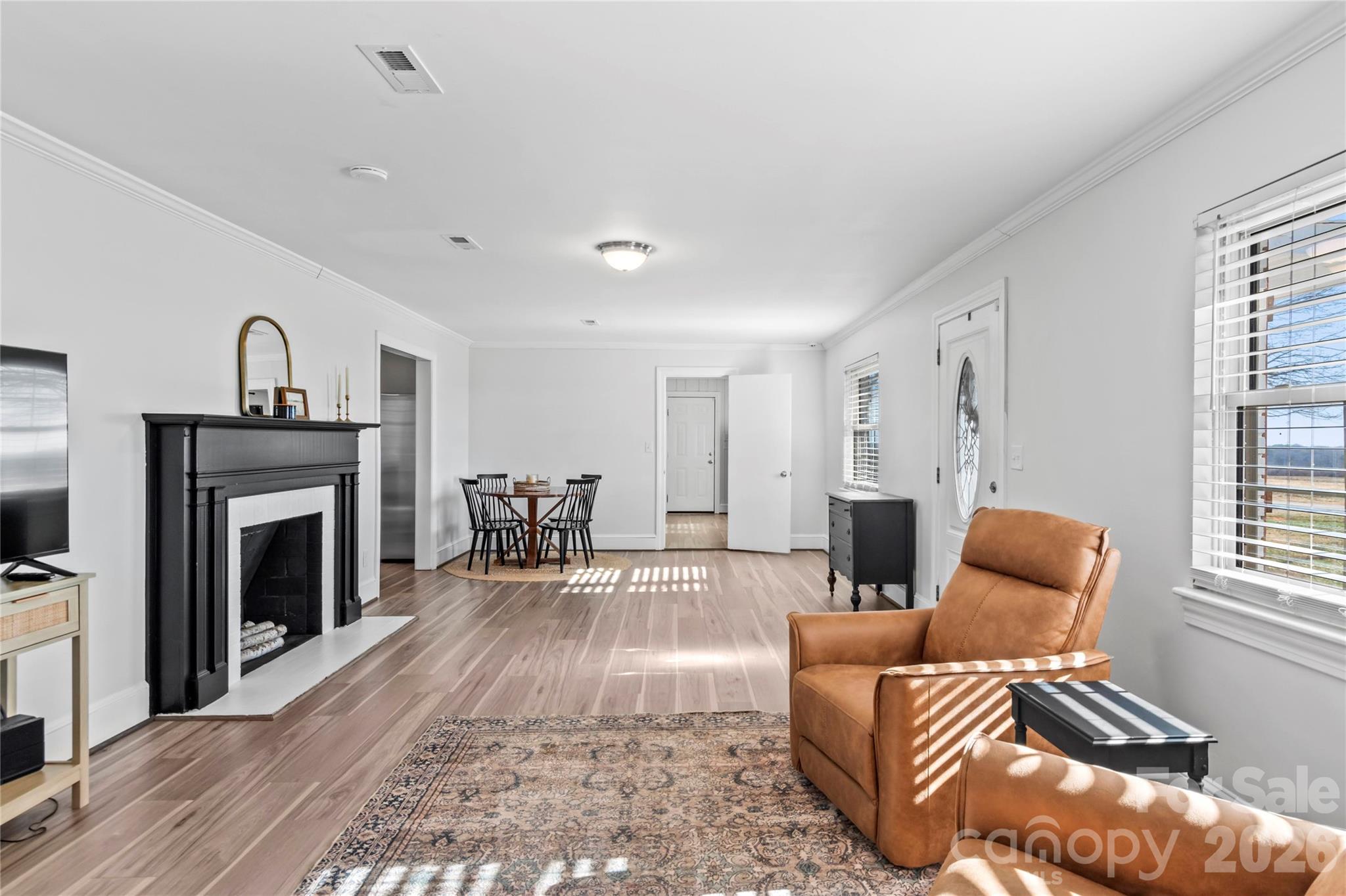 2432 Holcomb Road Yadkinville, NC 27055 - Photo 10 of 37 a living room with furniture and a fireplace