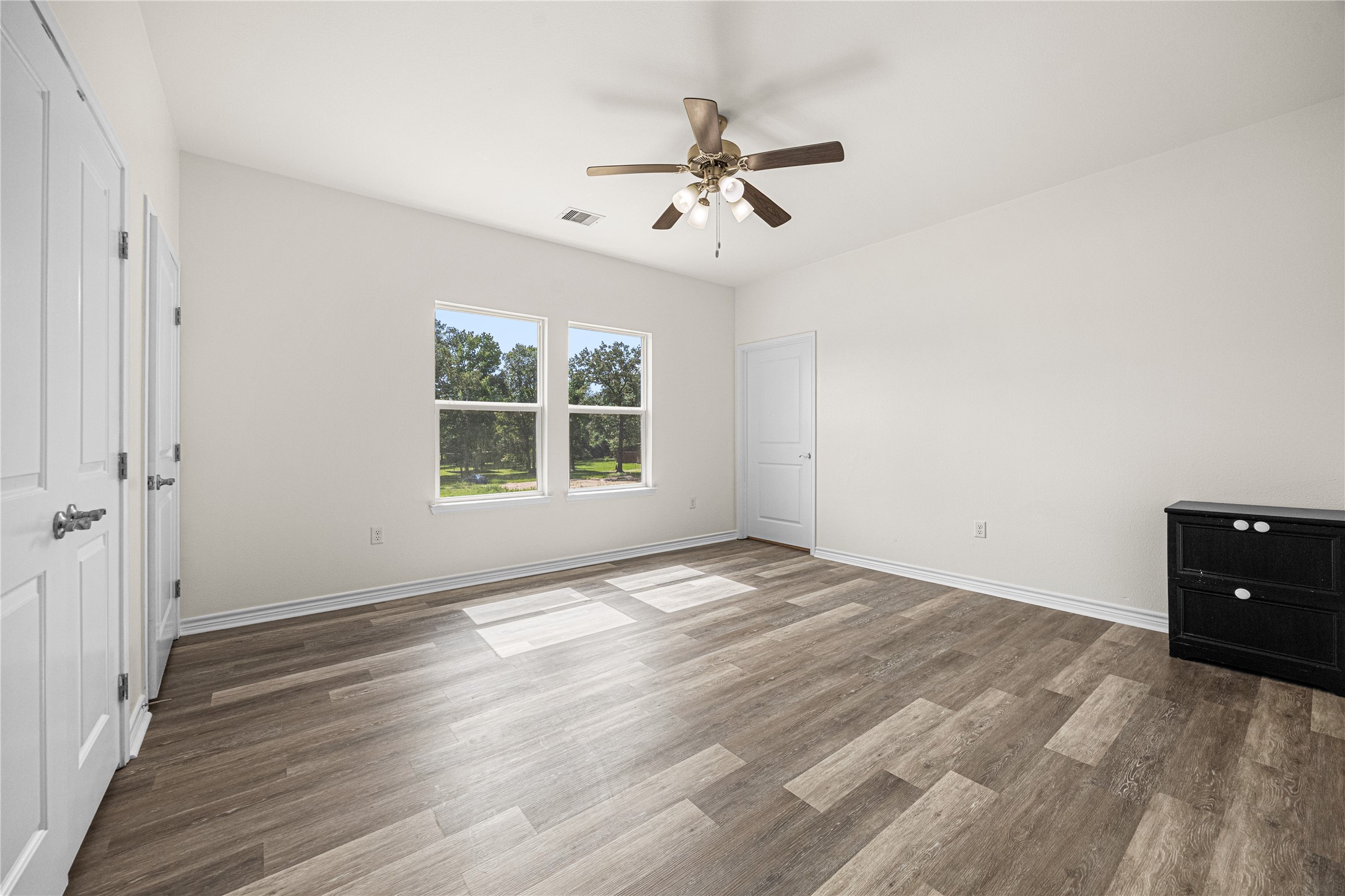 28096 7 Sisters Road, Unit A New Caney, TX 77357 - Photo 12 of 19 Primary bedroom with ensuite