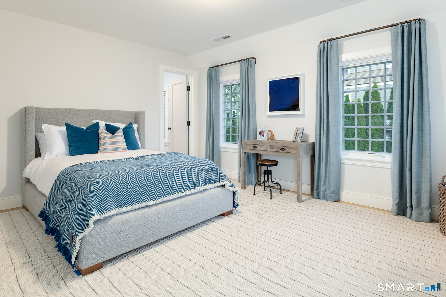 16 Juniper Road Norwalk, CT 06853 - Photo 22 of 30 a bedroom with a bed and a desk