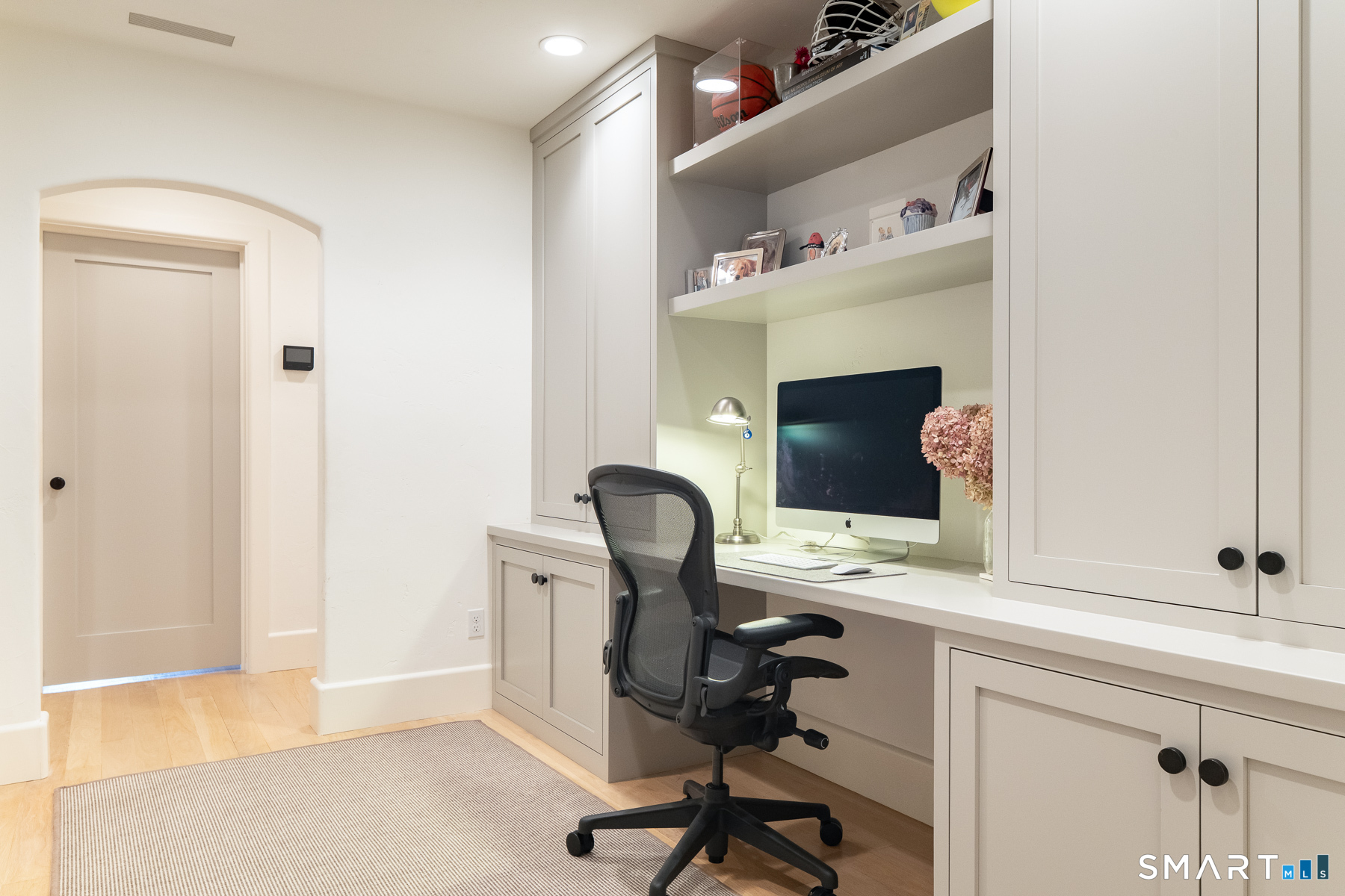 16 Juniper Road Norwalk, CT 06853 - Photo 26 of 30 a view of a workspace with furniture and a fireplace