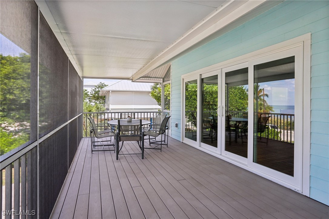 8335 Main Street Bokeelia, FL 33922 - Photo 9 of 47 a deck view with a seating space