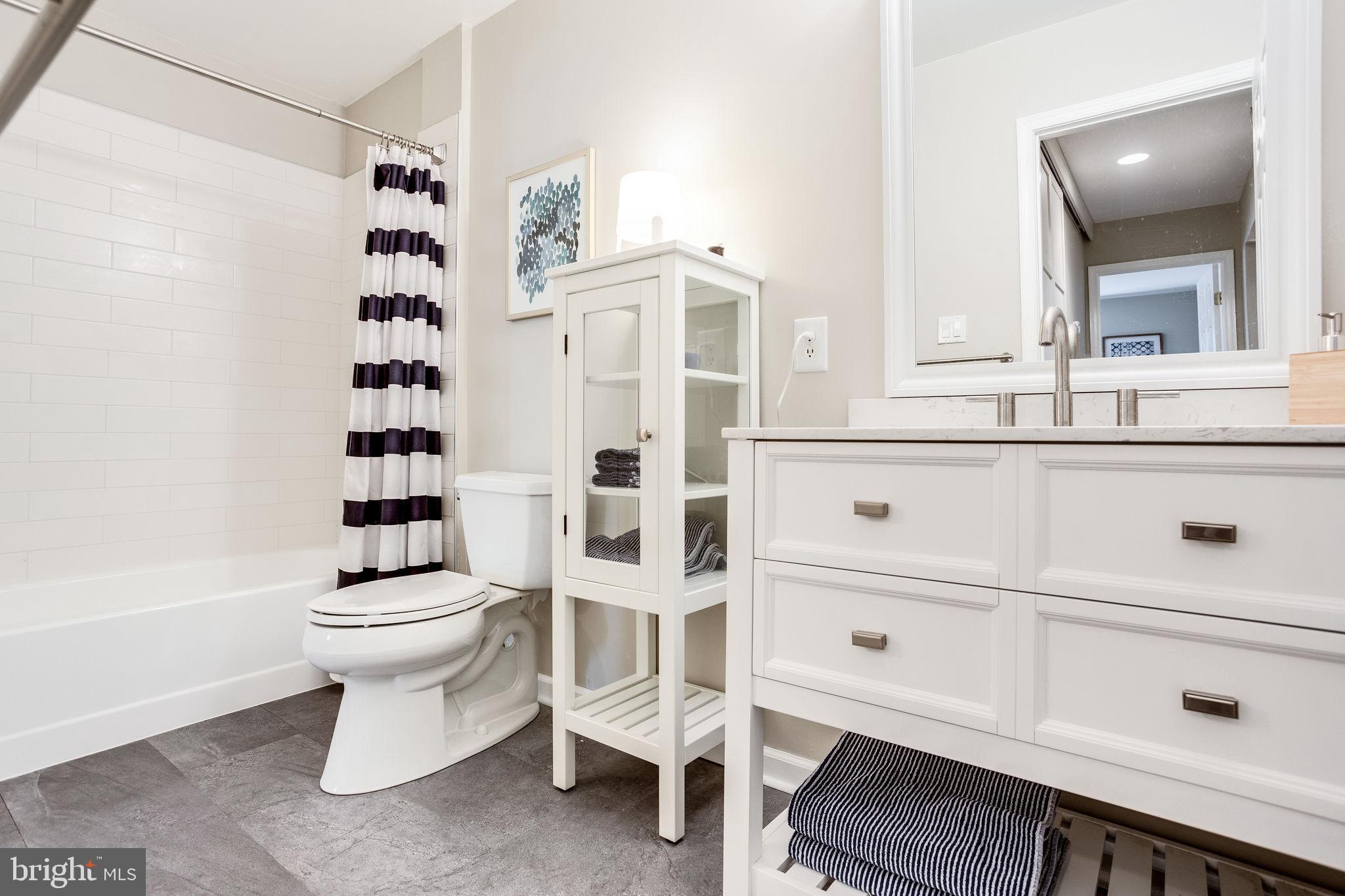 1911 Villaridge Drive, Unit A Reston, VA 20191 - Photo 16 of 35 New vanity and subway tile shower/tub