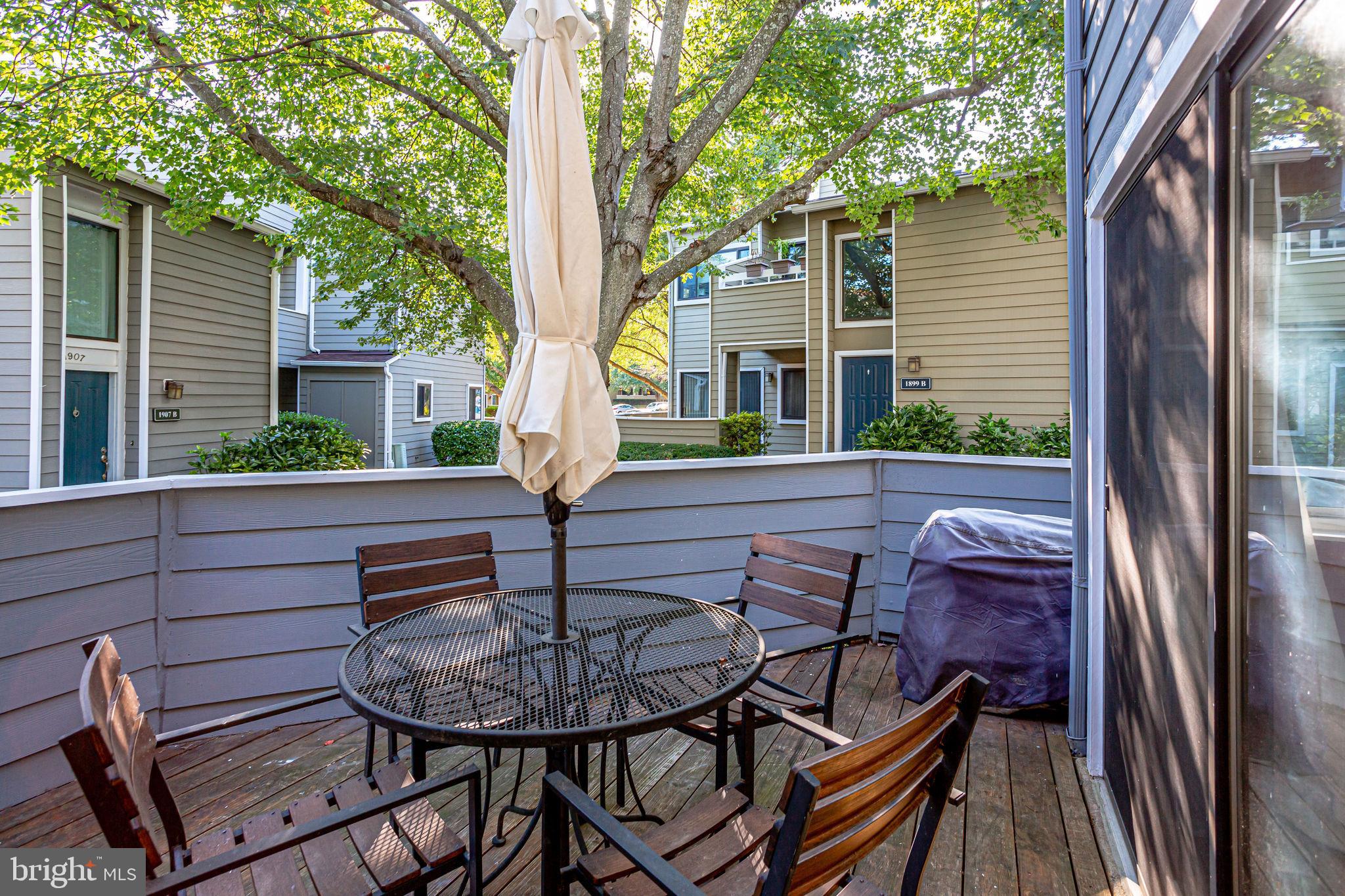 1911 Villaridge Drive, Unit A Reston, VA 20191 - Photo 3 of 35 Large patio with seating and shade