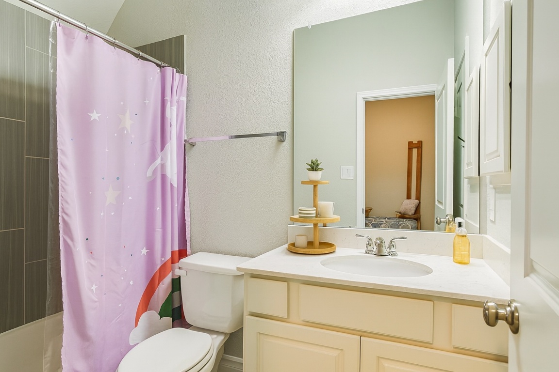 541 Cortona Lane Georgetown, TX 78628 - Photo 11 of 19 a bathroom with a sink toilet and shower