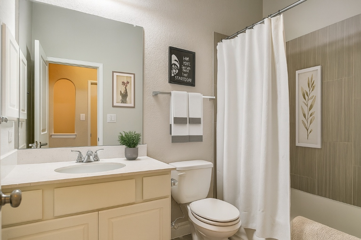 541 Cortona Lane Georgetown, TX 78628 - Photo 13 of 19 a bathroom with a granite countertop sink toilet and shower