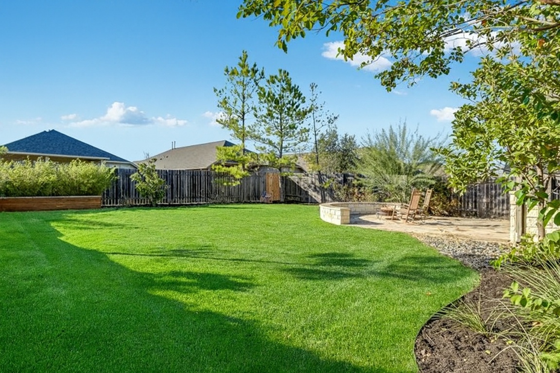 541 Cortona Lane Georgetown, TX 78628 - Photo 18 of 19 a view of a house with a yard
