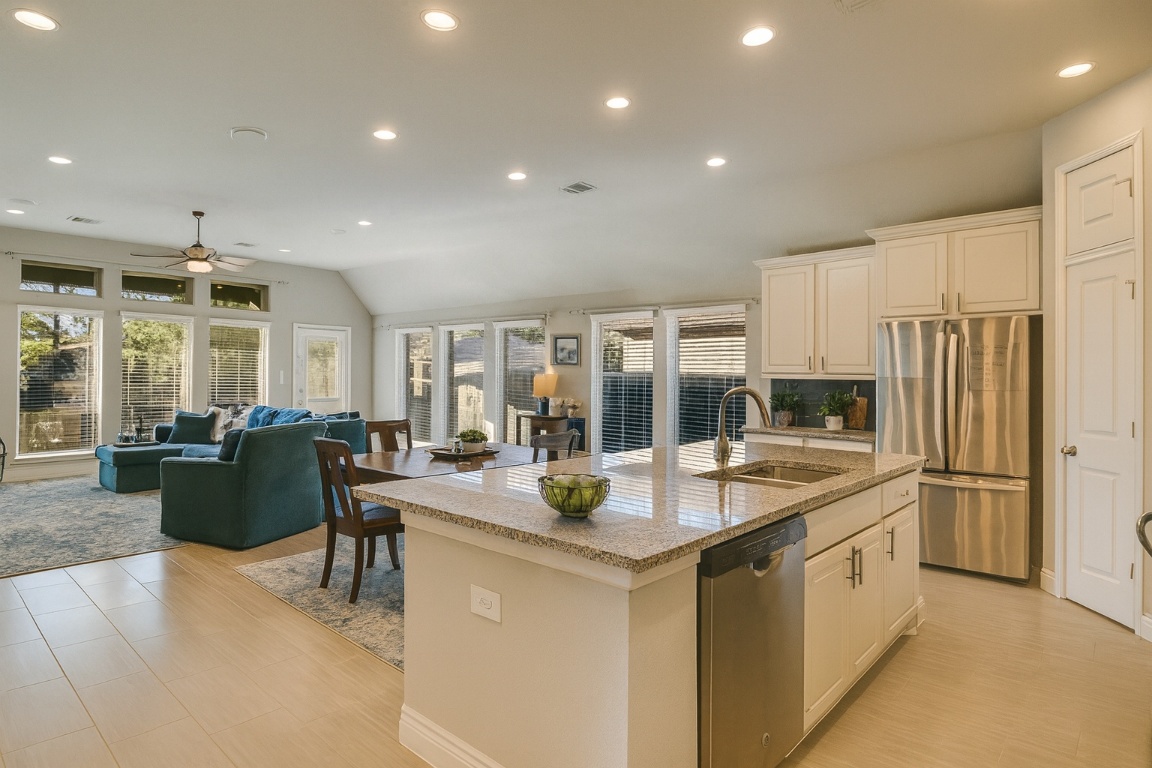 541 Cortona Lane Georgetown, TX 78628 - Photo 19 of 19 a kitchen with stainless steel appliances granite countertop a sink stove and refrigerator