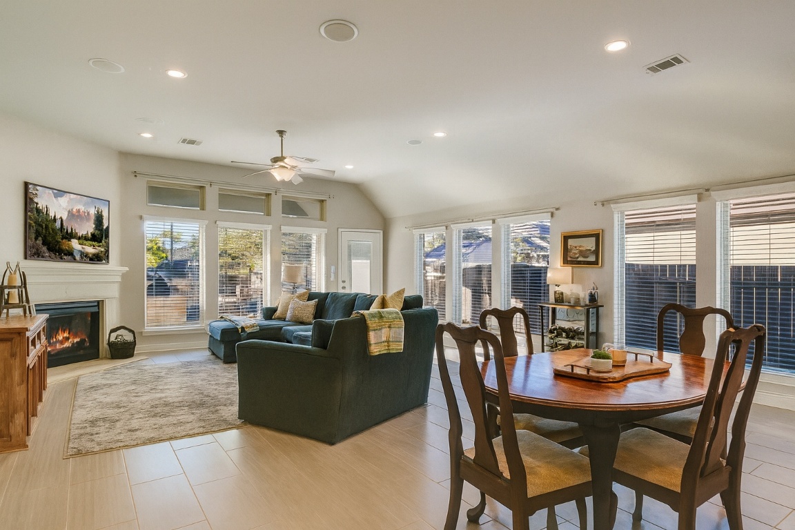 541 Cortona Lane Georgetown, TX 78628 - Photo 7 of 19 a view of a dining room with furniture window and wooden floor