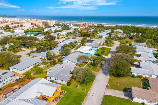 an aerial view of a house with a swimming pool outdoor seating and yard