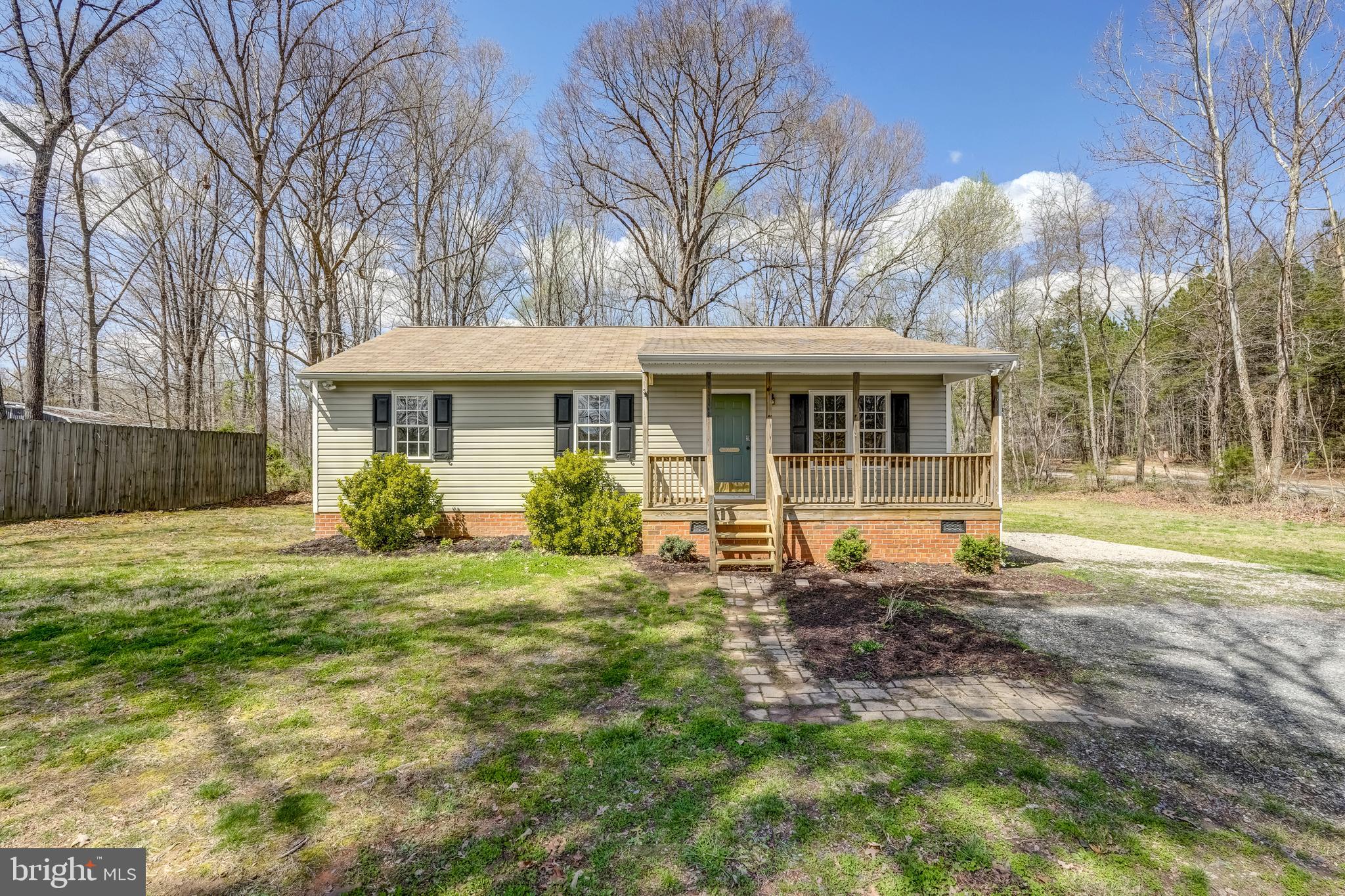 6021 Ridge Road Columbia, VA 23038 - Photo 1 of 40 a front view of a house with garden