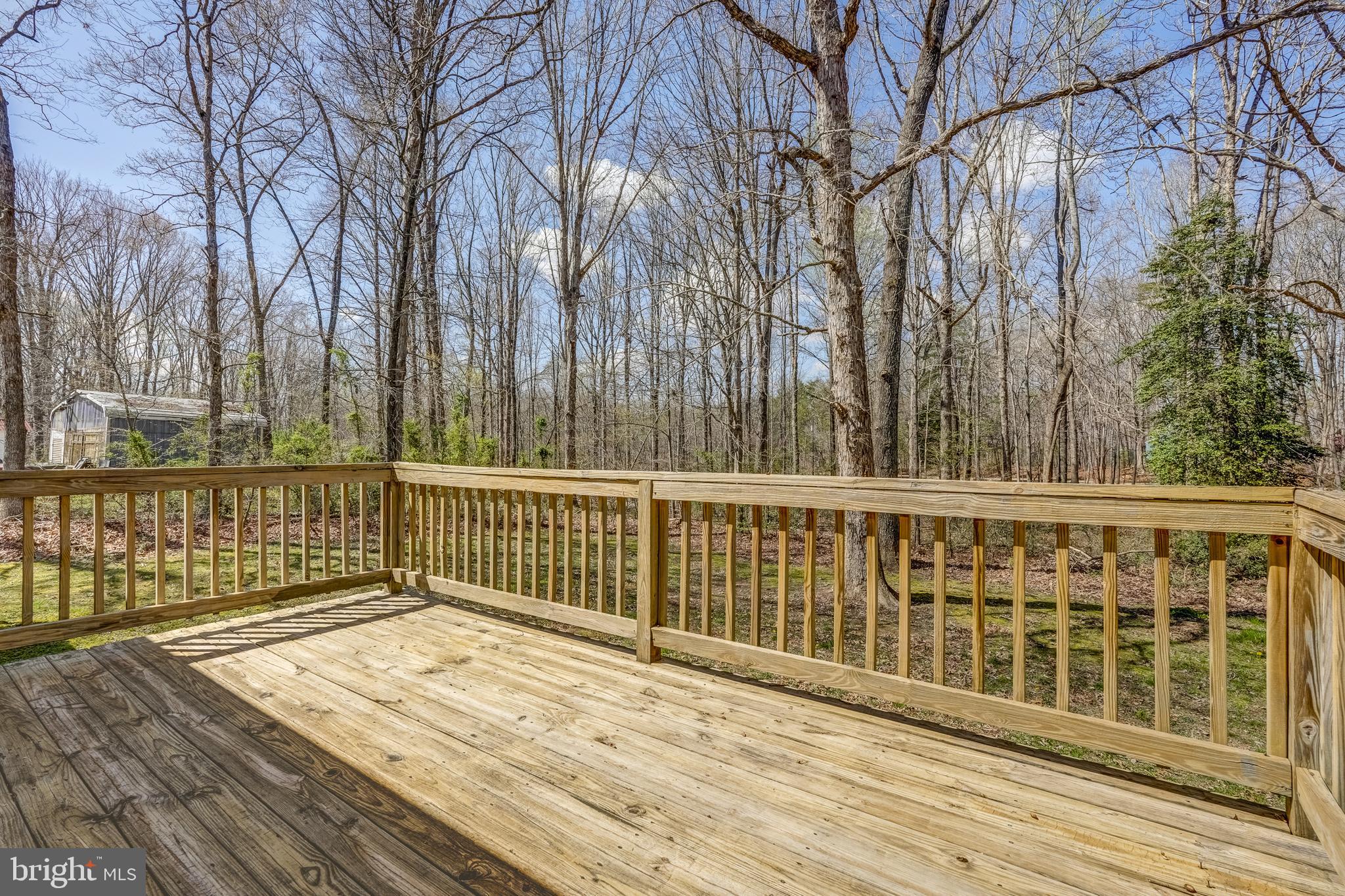 6021 Ridge Road Columbia, VA 23038 - Photo 12 of 40 a view of a balcony with wooden floor and fence