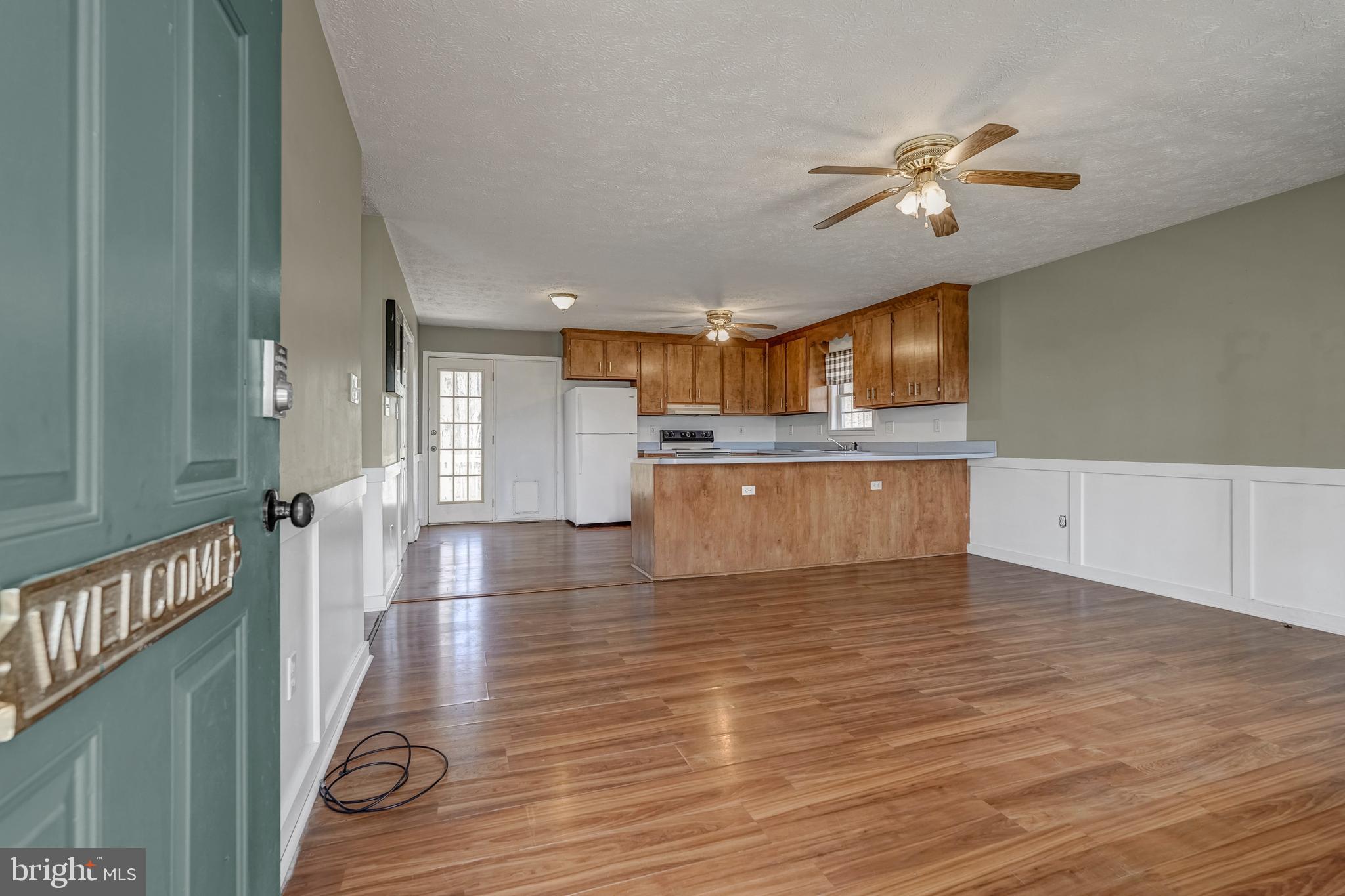 6021 Ridge Road Columbia, VA 23038 - Photo 20 of 40 a view of a kitchen with a sink cabinets and wooden floor