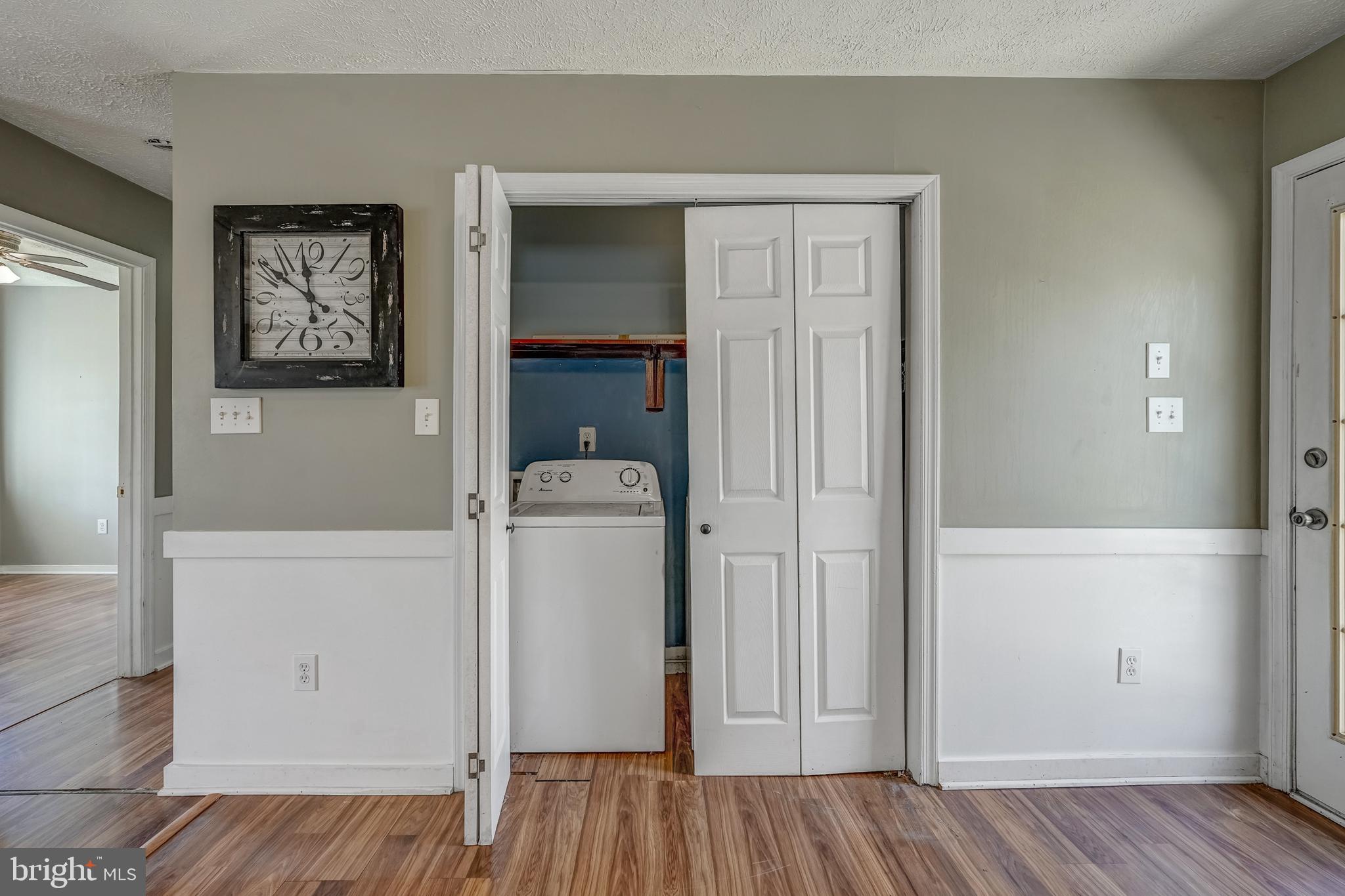 6021 Ridge Road Columbia, VA 23038 - Photo 30 of 40 a view of storage and utility room with closet and wooden floor