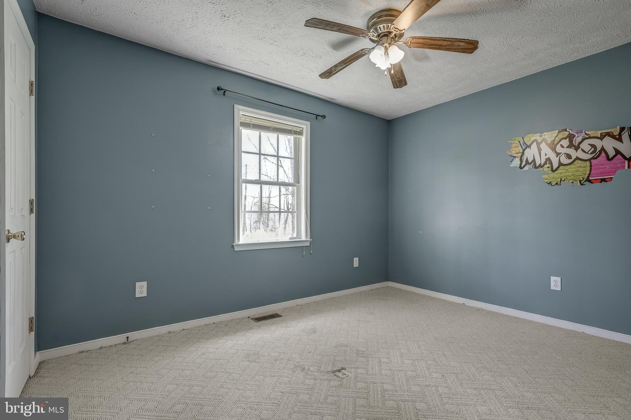 6021 Ridge Road Columbia, VA 23038 - Photo 34 of 40 a view of room with a ceiling fan and a window