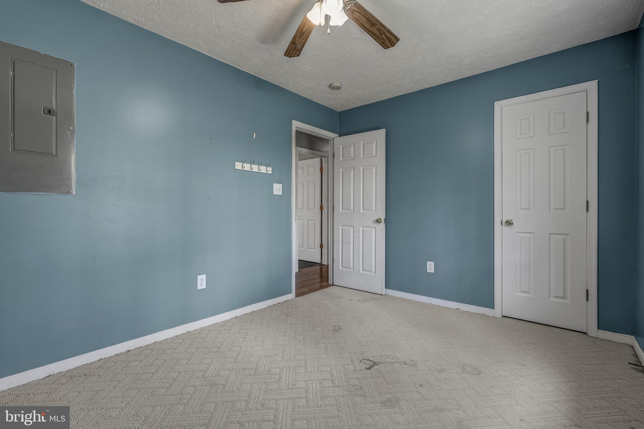 6021 Ridge Road Columbia, VA 23038 - Photo 35 of 40 a view of an empty room and a ceiling fan