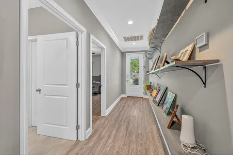 a room with gym equipment and mirrors